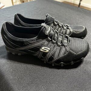 Skechers Women's Black Slip-On Athletic Sneakers with Ring Lace Detail